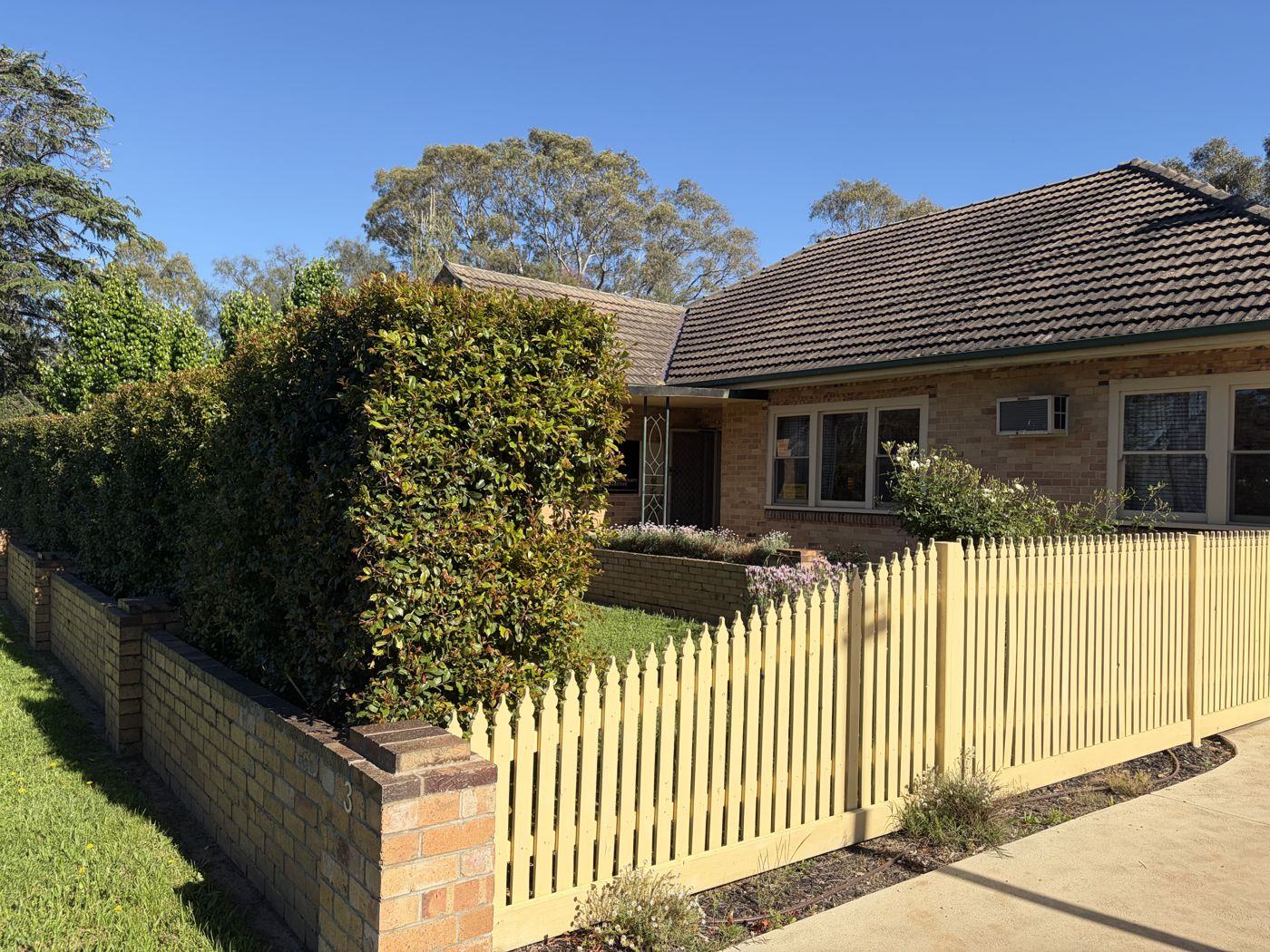 The pale picket fence at the front of 3 Lansell Street